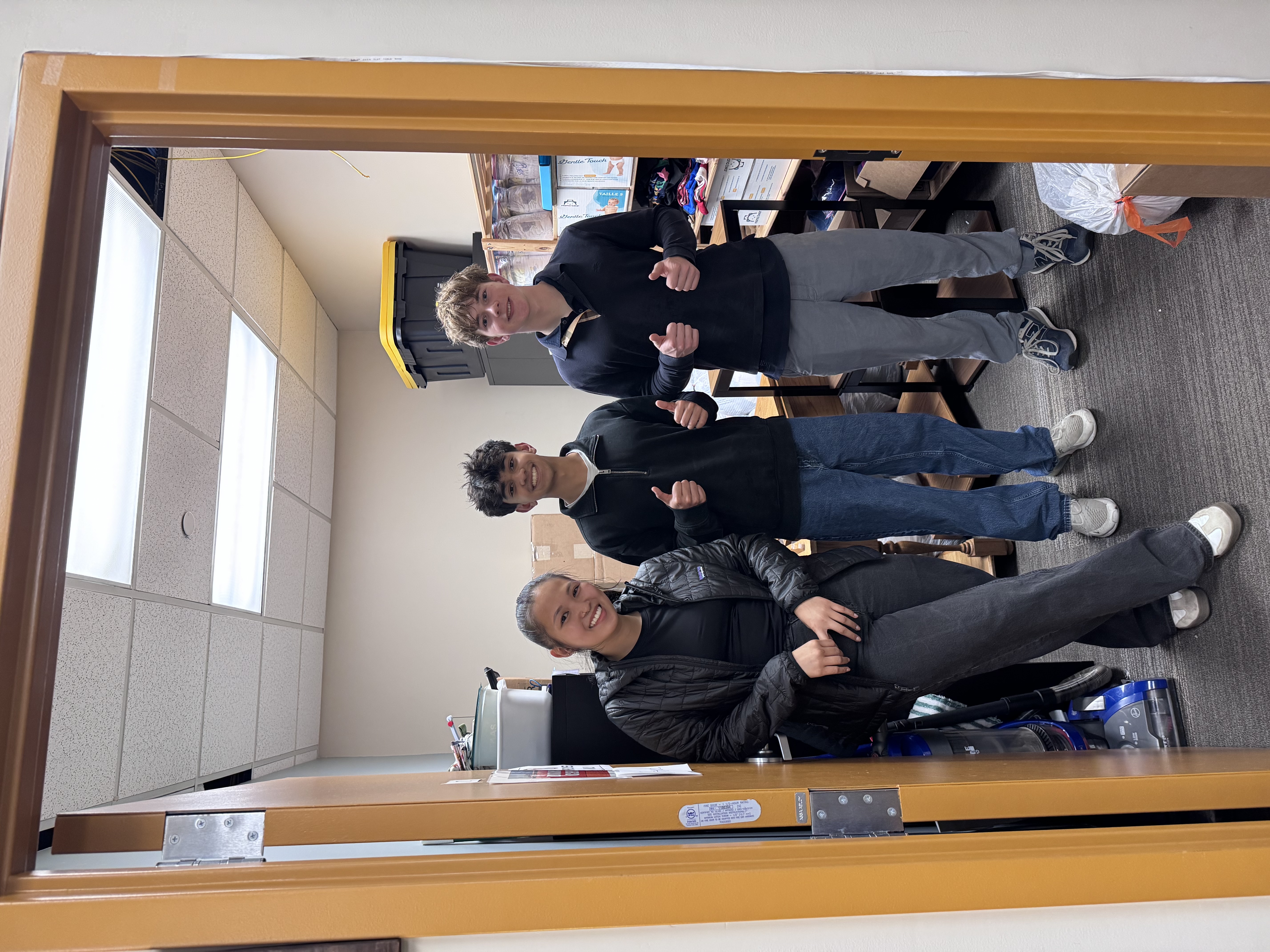 Project Ascend volunteers in the donation storage room